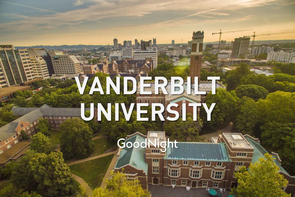A sweeping view of Vanderbilt University's iconic buildings, including the clock tower, lush green spaces, and the city skyline in the distance. The scene is filled with inspiration and prestige, reflecting a hub of innovation and learning.