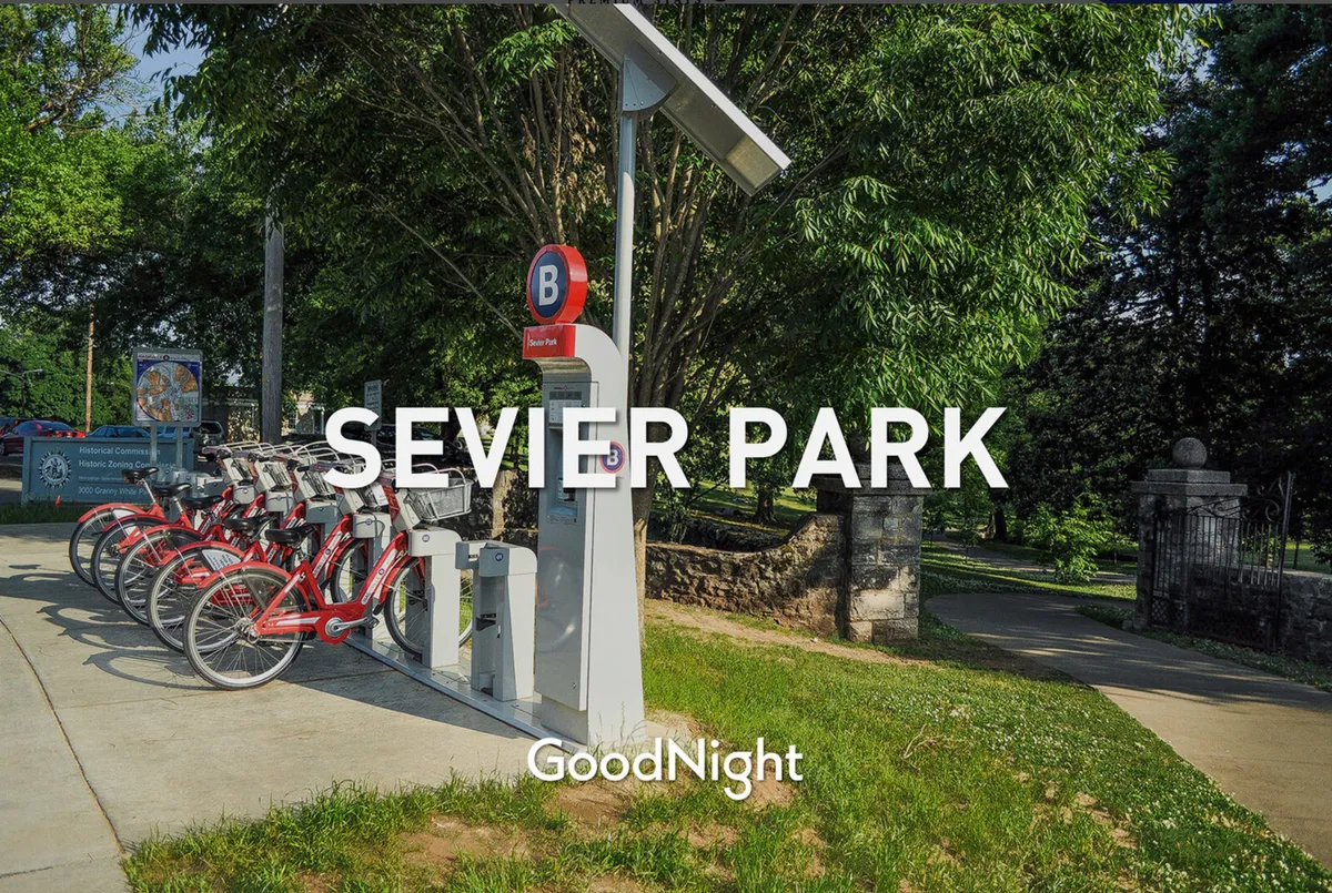 A vibrant, energetic park scene showing a bike rental station, park signage, and lush greenery. The image suggests active, outdoor fun, with opportunities for biking, walking, and picnicking in a welcoming neighborhood environment.